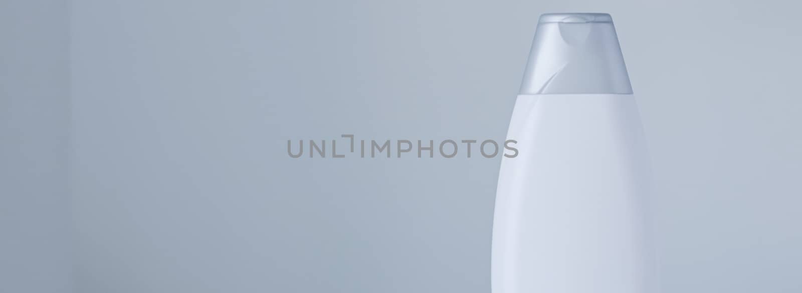 Blank label cosmetic container bottle as product mockup on gray background, hygiene and healthcare