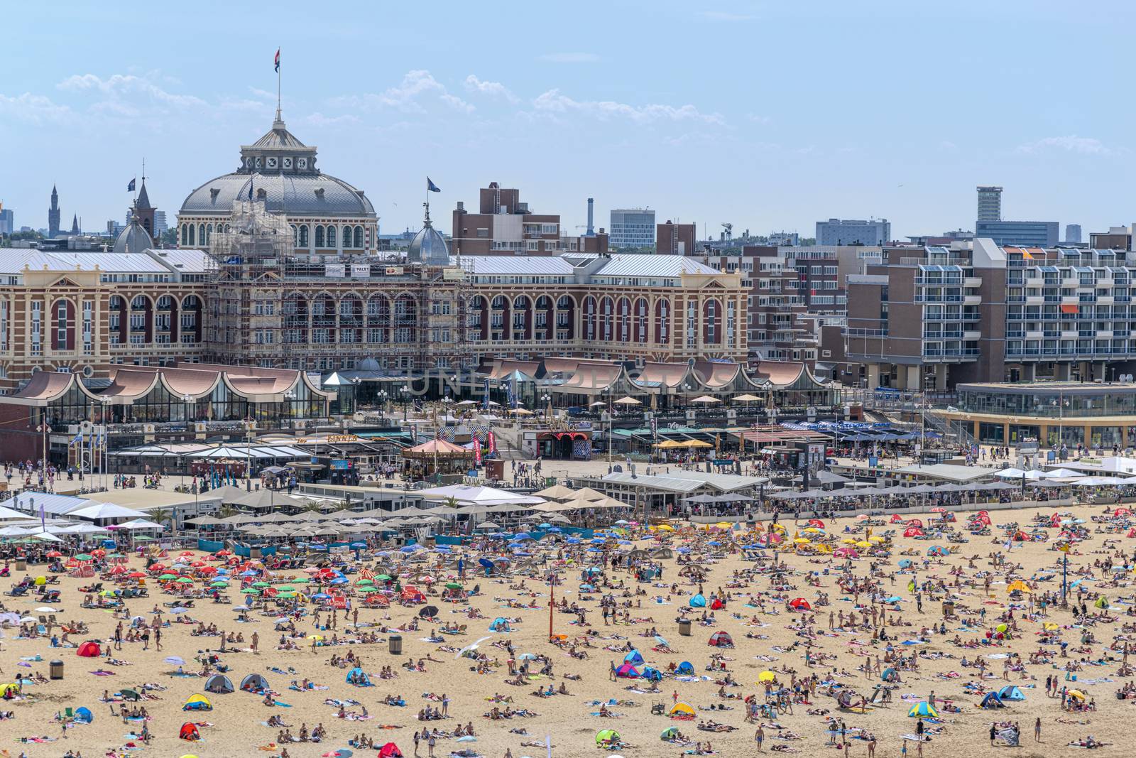 SCHEVENINGEN, 2 June 2019 - Aerial view of the beach of The Hague with crowded people enjoying take sun bath during the hot and sunny day before the summer. by ankorlight