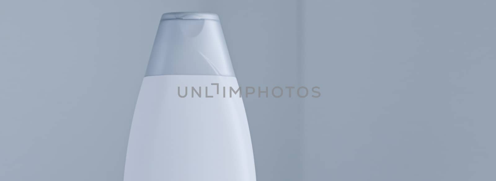 Blank label cosmetic container bottle as product mockup on gray background, hygiene and healthcare