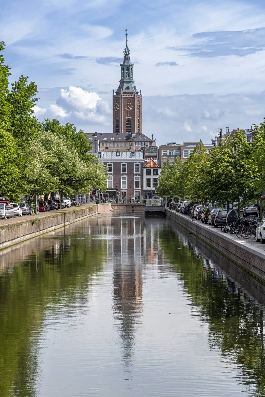 Saint James church reflected on the canal calm water nested to the royal stable, in The Hague  by ankorlight