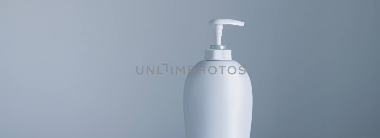 Blank label cosmetic container bottle as product mockup on gray background, hygiene and healthcare