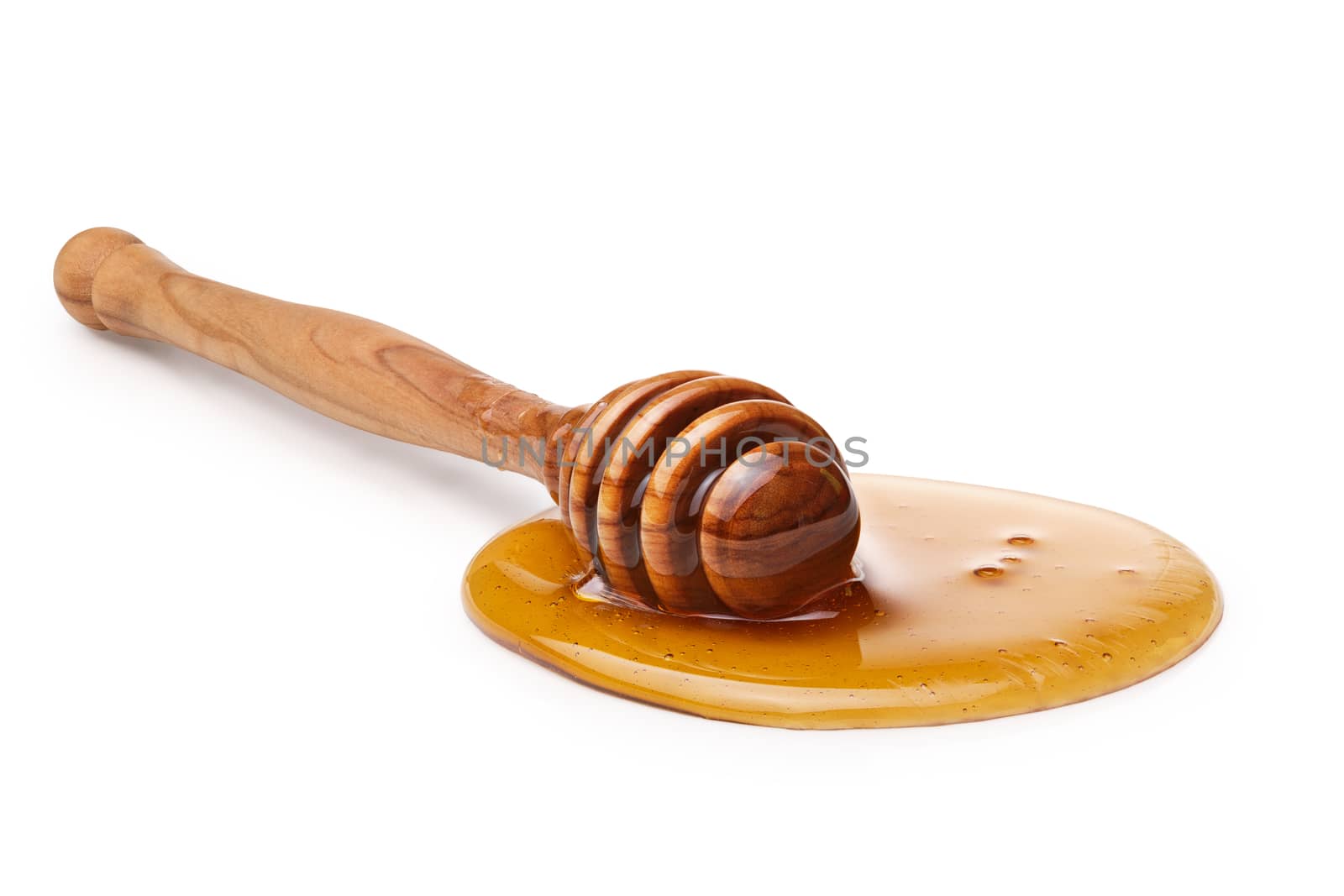Wooden honey dipper with honey. Infinite depth of field,clipping paths