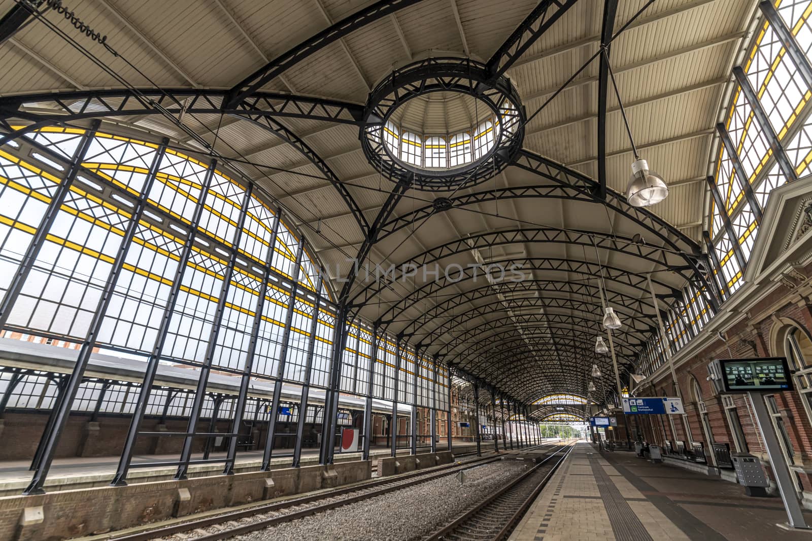 THE HAGUE, 10 June 2019 - view of the 'Art Deco' architecture style of the Den Haag HS train station platform with no traveler by ankorlight