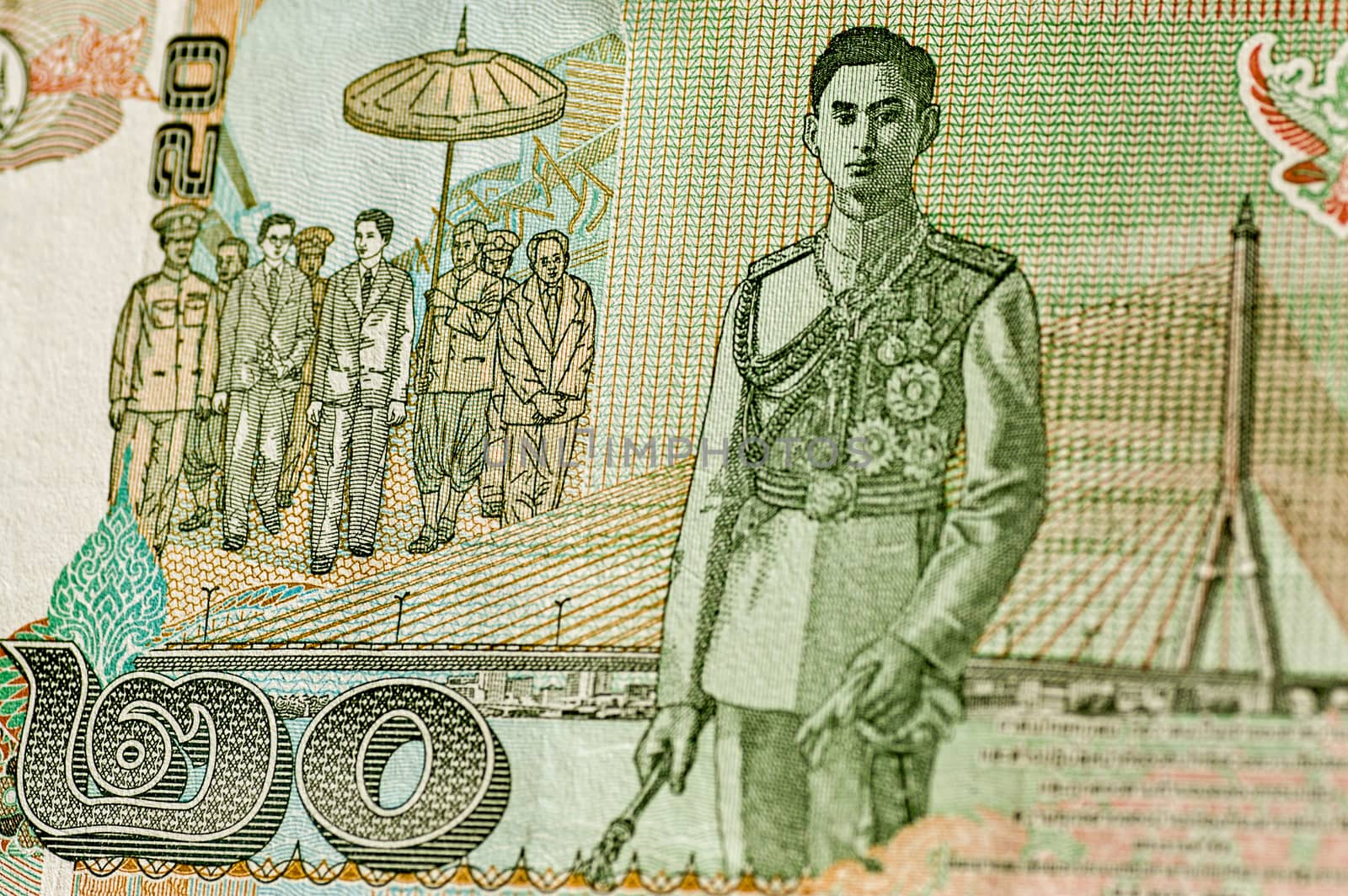 Reverse of Thailand 20 Baht banknote showing His Majesty King Ananda Mahidol, known as King Rama VIII and a modern bridge. Used banknote, shown at an angle.