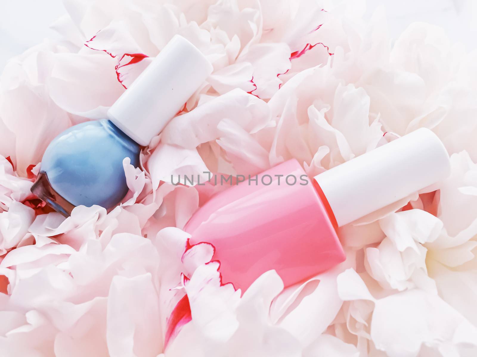 Nail polish bottles on floral background, french manicure and cosmetic branding by Anneleven