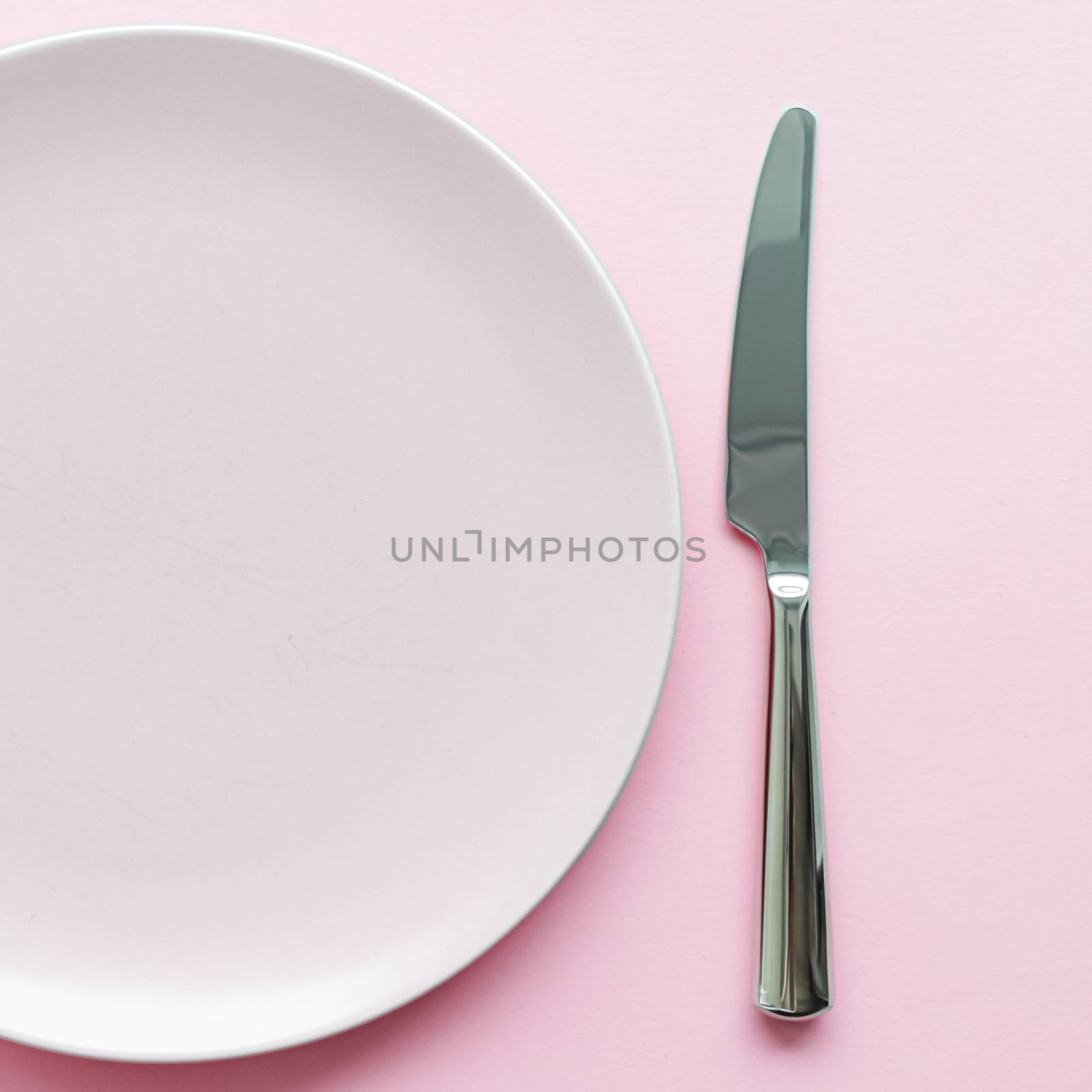 Empty plate and cutlery as mockup set on pink background, top tableware for chef table decor and menu branding by Anneleven