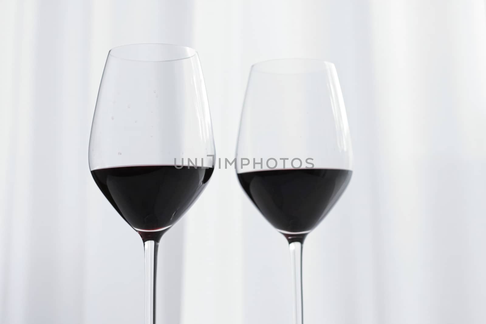 Two crystal glasses of red wine, organic beverage product
