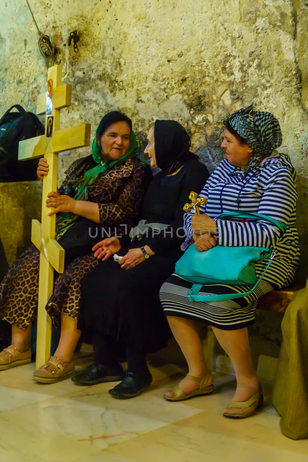Jerusalem, Israel - April 6, 2018: Orthodox good Friday scene in the church of the holy sepulcher, with pilgrims. The old city of Jerusalem, Israel