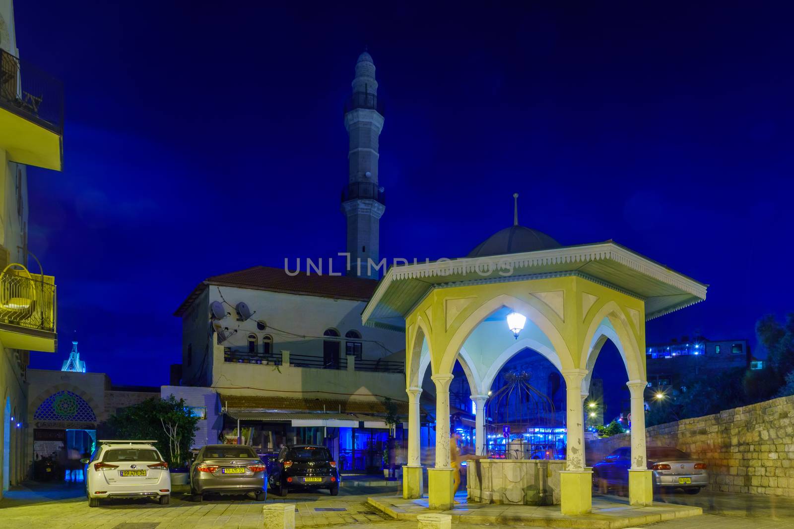 Tel-Aviv, Israel - September 19, 2019: Night view of the Sebil Abu-Nabut B in the old city of Jaffa, with Locals and visitors. Now part of Tel-Aviv-Yafo, Israel. Sebil is Ottoman era public fountain