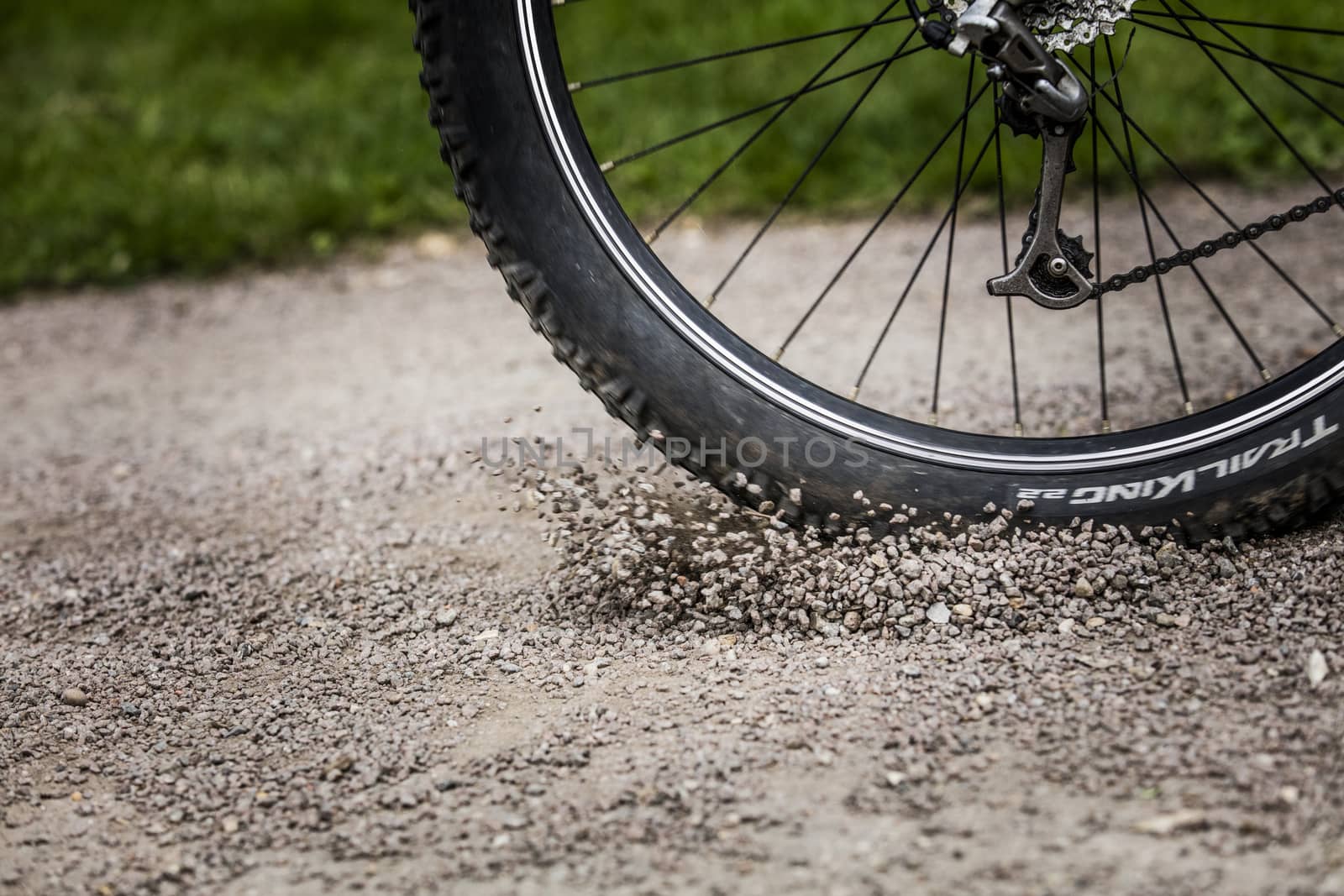 Tealby, Lincolnshire, UK, July 2017, Bike tire kicking up stones