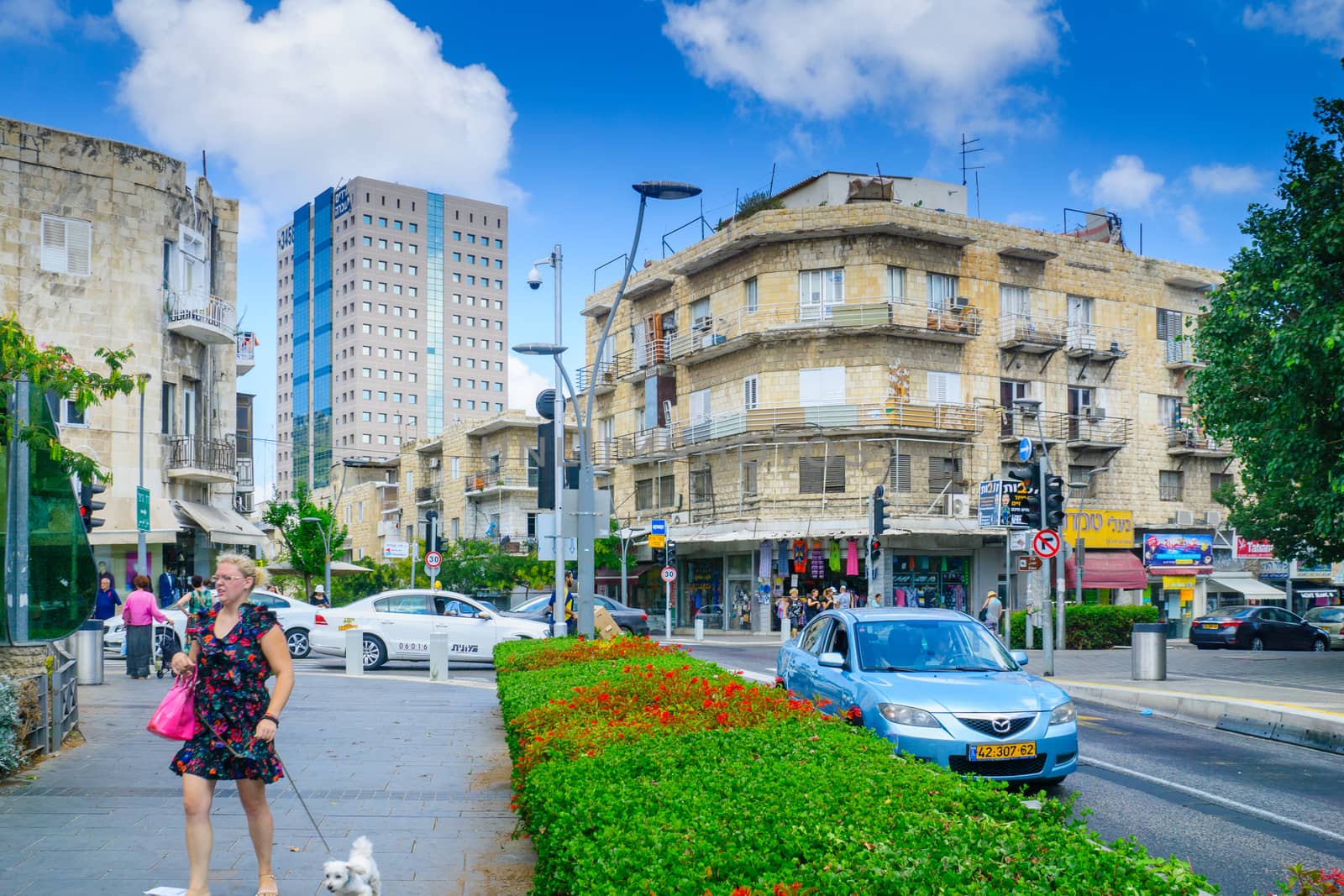 HAIFA, ISRAEL - AUGUST 18, 2016: Scene of Hadar HaCarmel district, with local businesses, locals and visitors, in Haifa, Israel