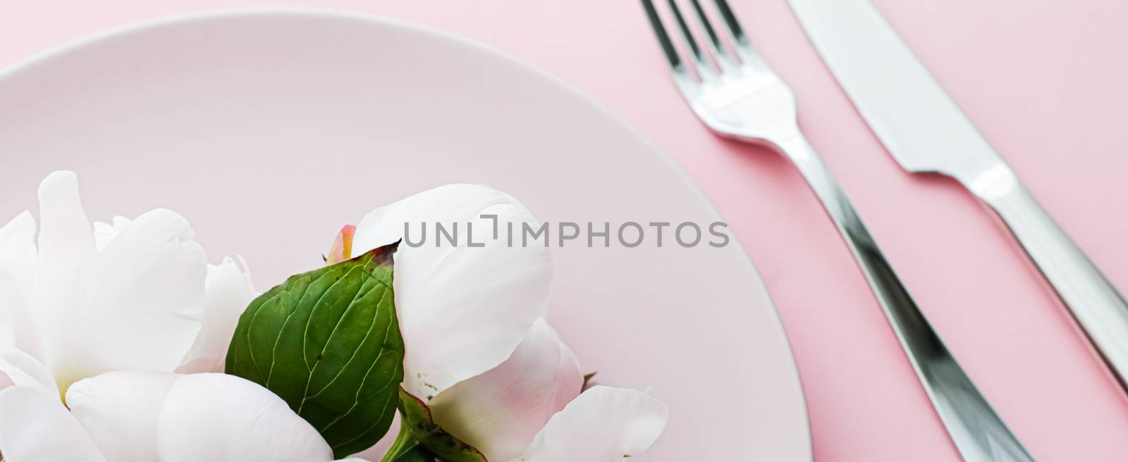 Dining plate and cutlery with peony flowers as wedding decor set on pink background, top tableware for event decoration and menu branding design