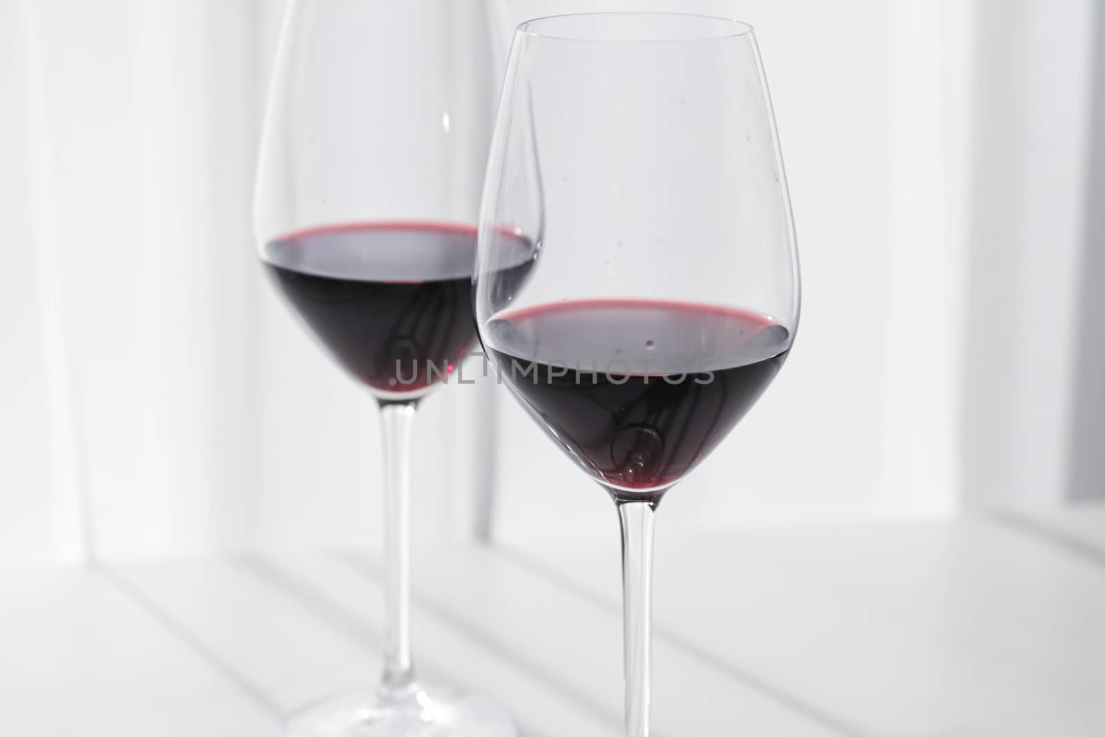 Two crystal glasses of red wine, organic beverage product