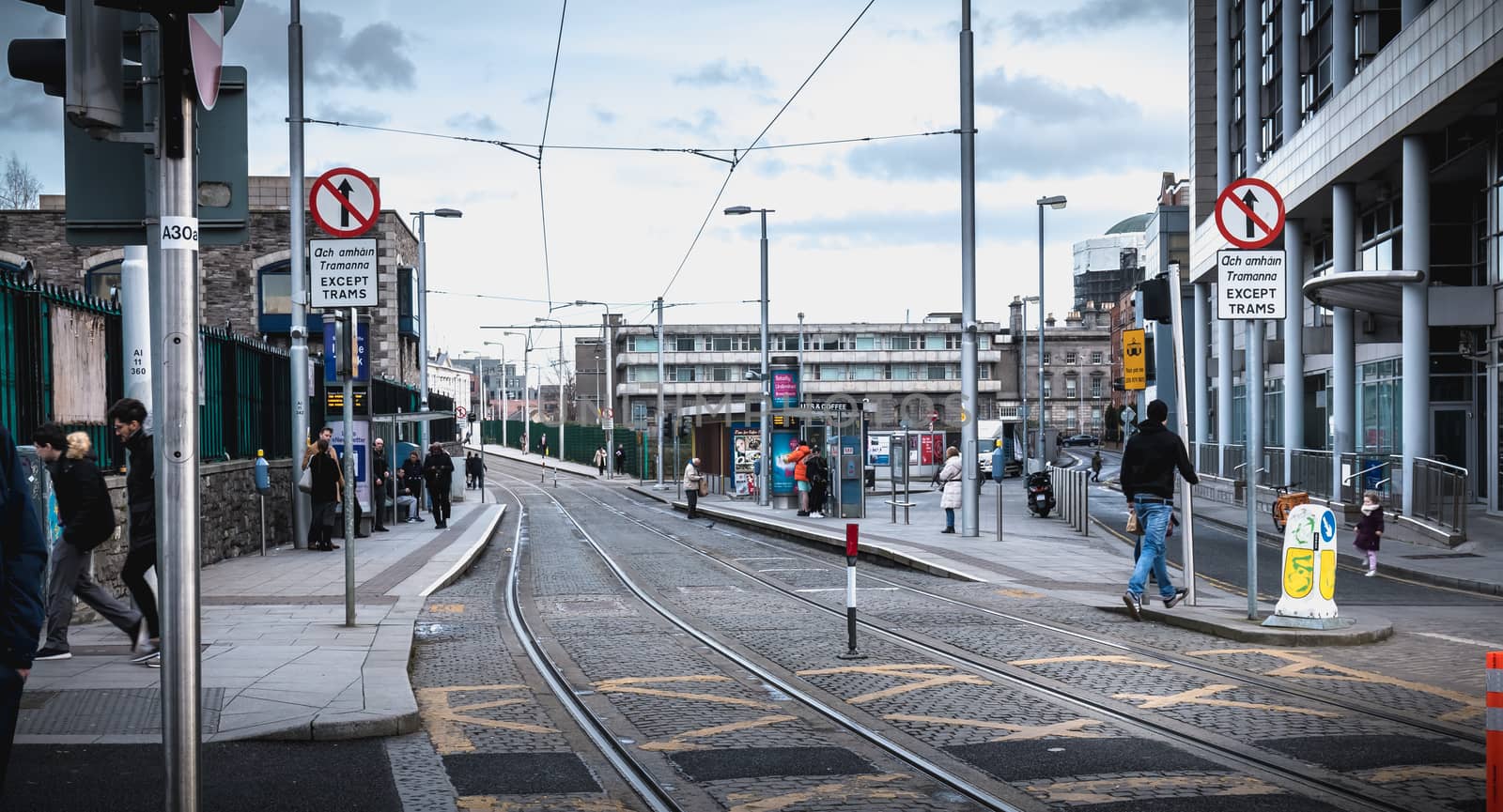 Passengers waiting for an electric tram in Dublin, Ireland by AtlanticEUROSTOXX