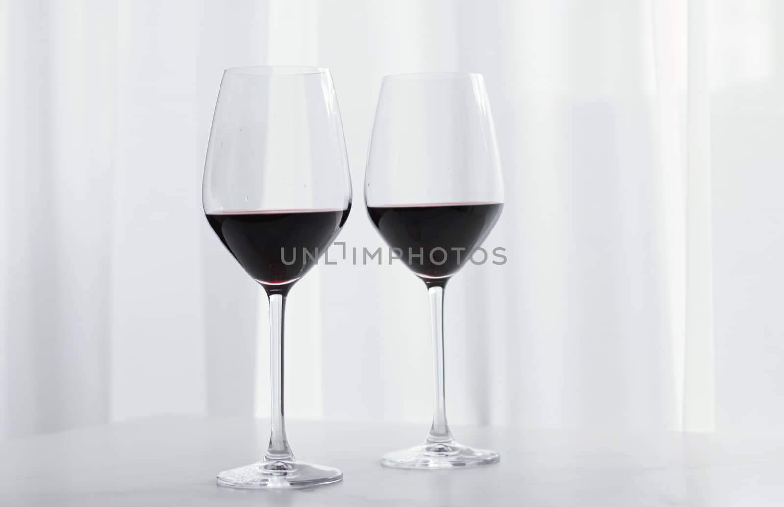 Two crystal glasses of red wine, organic beverage product