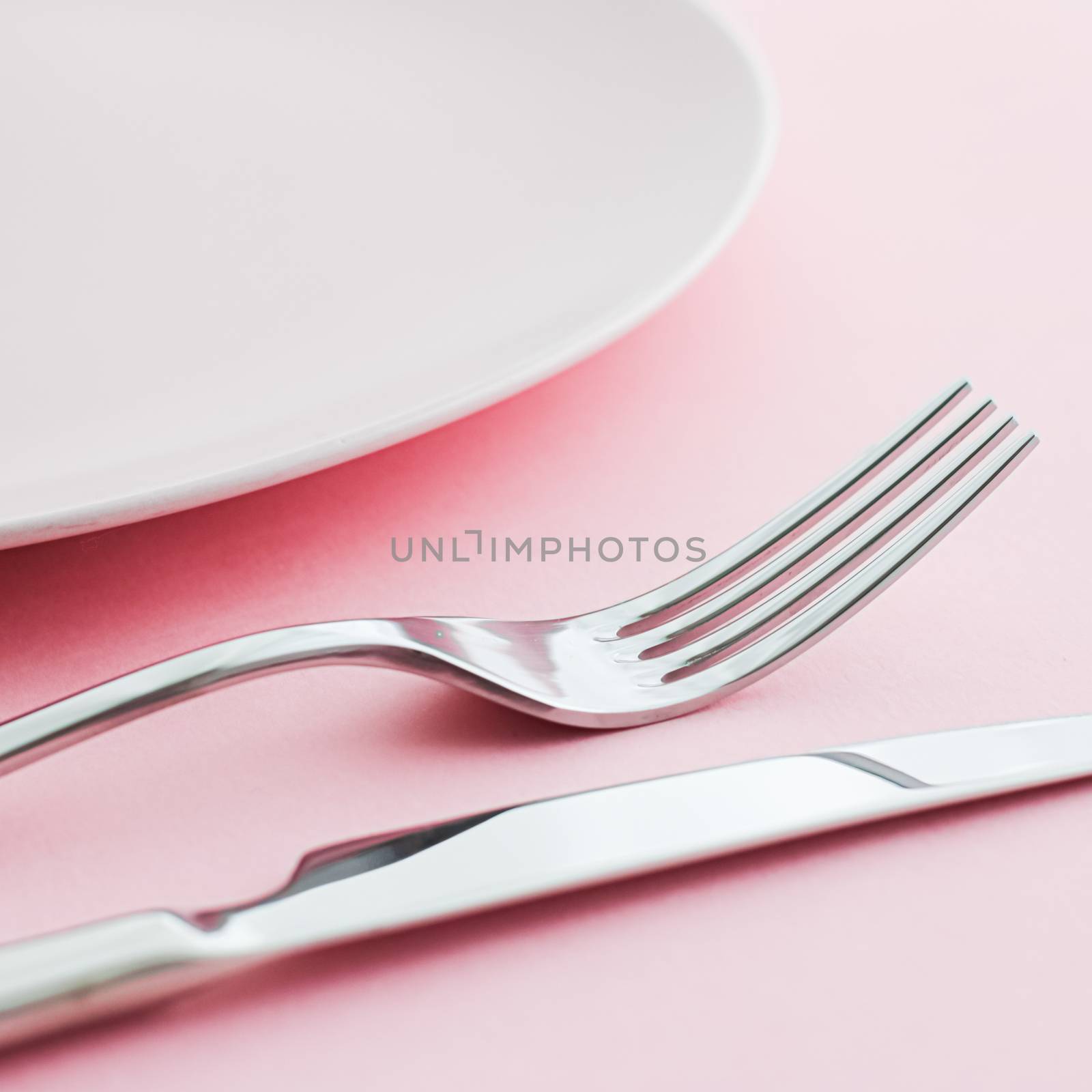 Empty plate and cutlery as mockup set on pink background, top tableware for chef table decor and menu branding design