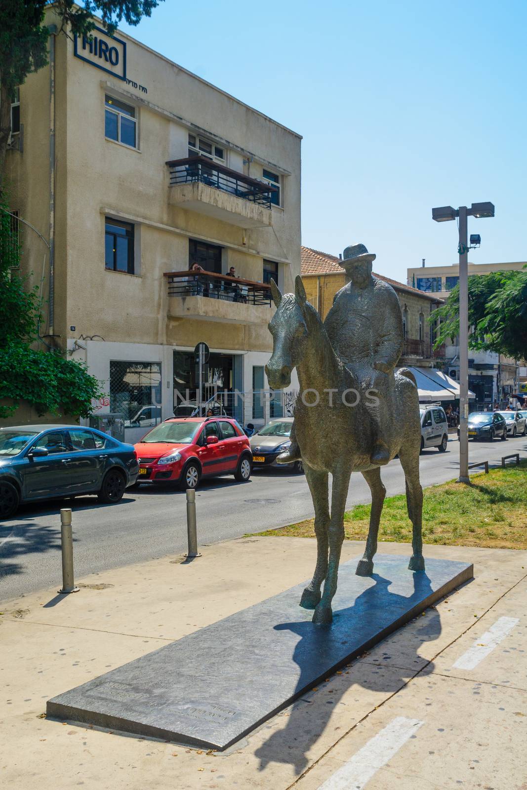 TEL-AVIV, ISRAEL - AUGUST 31, 2016: Street scene of the Rothschild Boulevard, with Meir Dizengoff (the first mayor) Statue, local businesses, locals and visitors. In Tel-Aviv, Israel