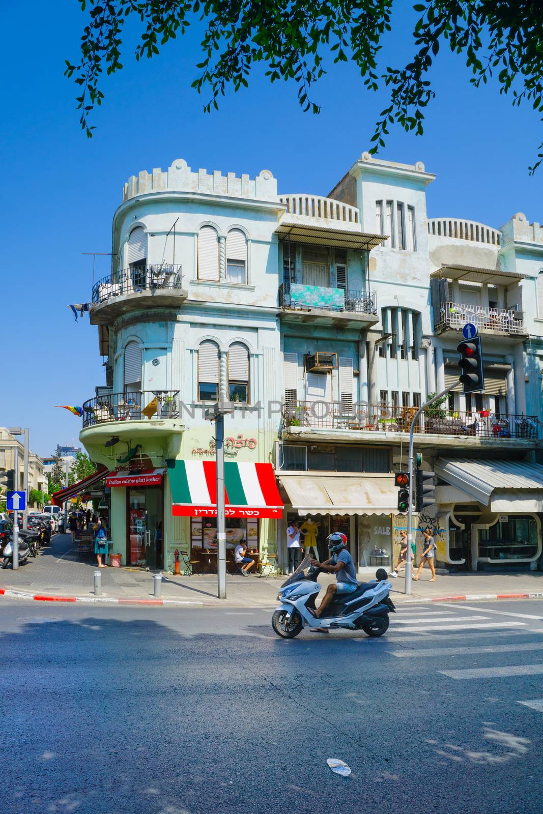 TEL-AVIV, ISRAEL - AUGUST 31, 2016: Scene of Allenby street, with Bauhaus style buildings, local businesses, locals and visitors. In Tel-Aviv, Israel