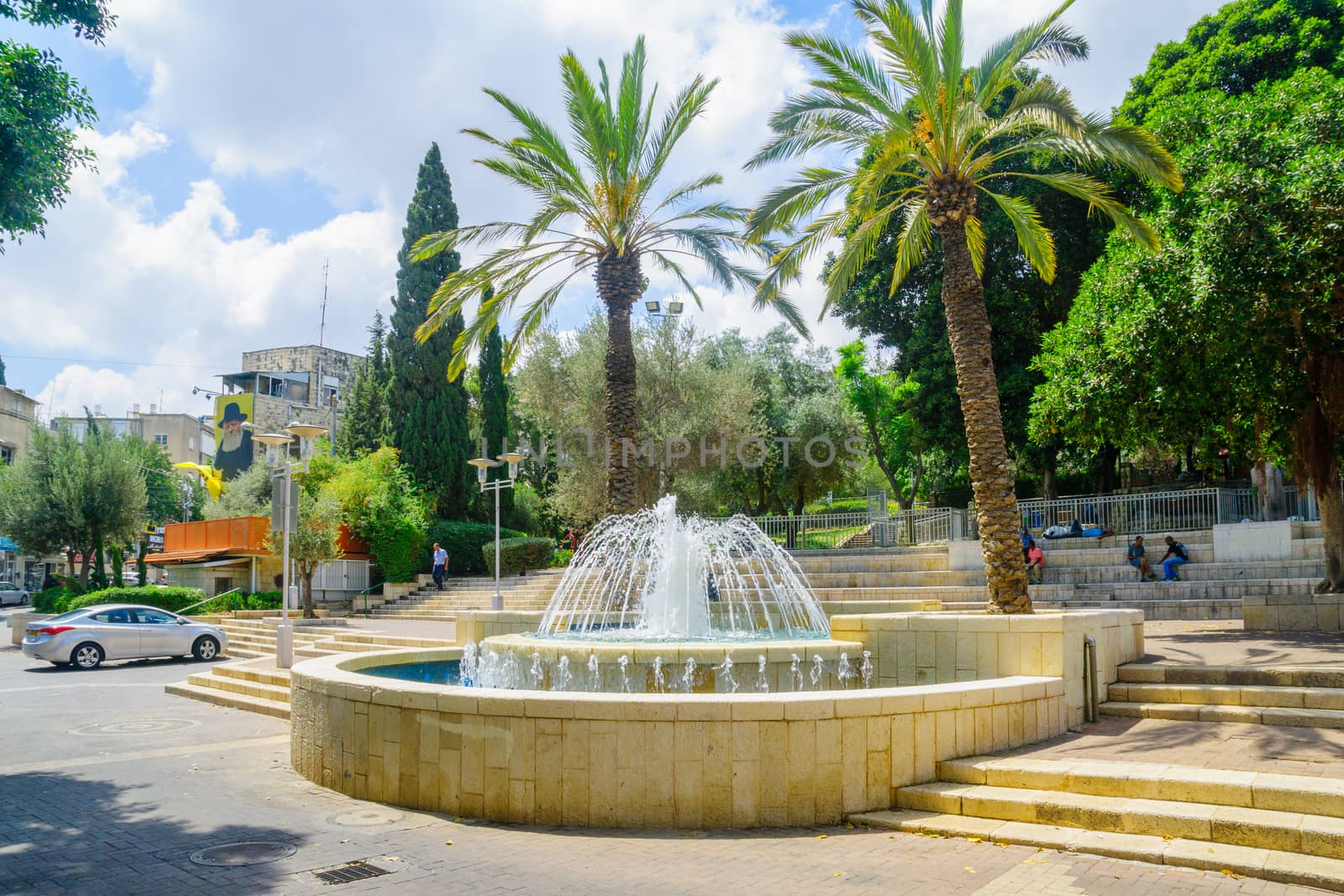 HAIFA, ISRAEL - AUGUST 18, 2016: View of Binyamin Garden, with a fountain, locals and visitors, in Hadar HaCarmel district, Haifa, Israel
