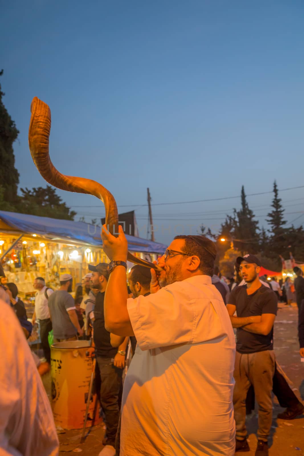 MERON, ISRAEL - MAY 03, 2018: Jewish men blows a shofar, at the annual hillula of Rabbi Shimon Bar Yochai, in Meron, Israel, on Lag BaOmer Holiday