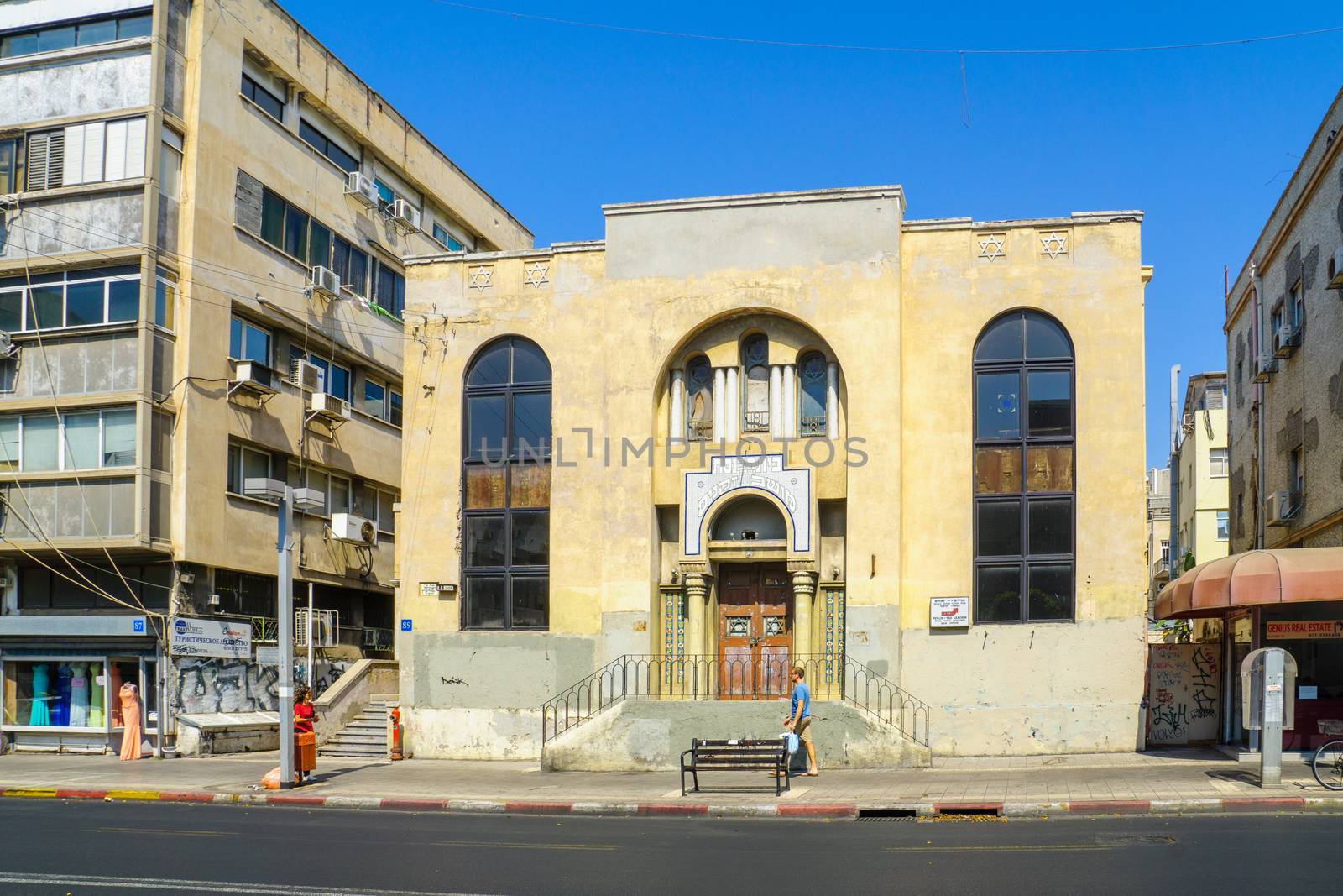 TEL-AVIV, ISRAEL - AUGUST 31, 2016: Scene of Allenby street, with the Moshav Zekenim synagogue, local businesses, locals and visitors. In Tel-Aviv, Israel
