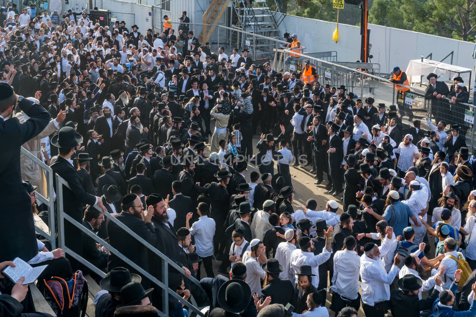 MERON, ISRAEL - MAY 03, 2018: Orthodox Jewish men attend and dance, at the annual hillula of Rabbi Shimon Bar Yochai, in Meron, Israel, on Lag BaOmer Holiday