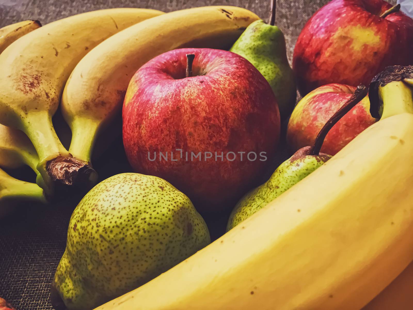 Organic apples, pears and bananas on rustic linen background, fruits farming and agriculture