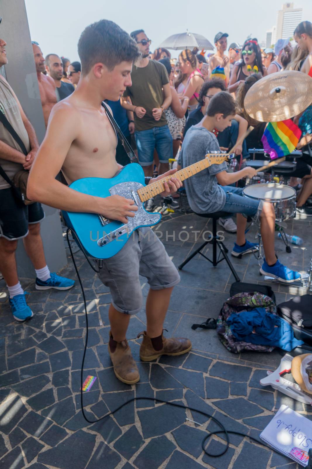 TEL-AVIV, ISRAEL - JUNE 08, 2018: People play music to the celebrating crowd in the annual pride parade of the LGBT community, in Tel-Aviv, Israel