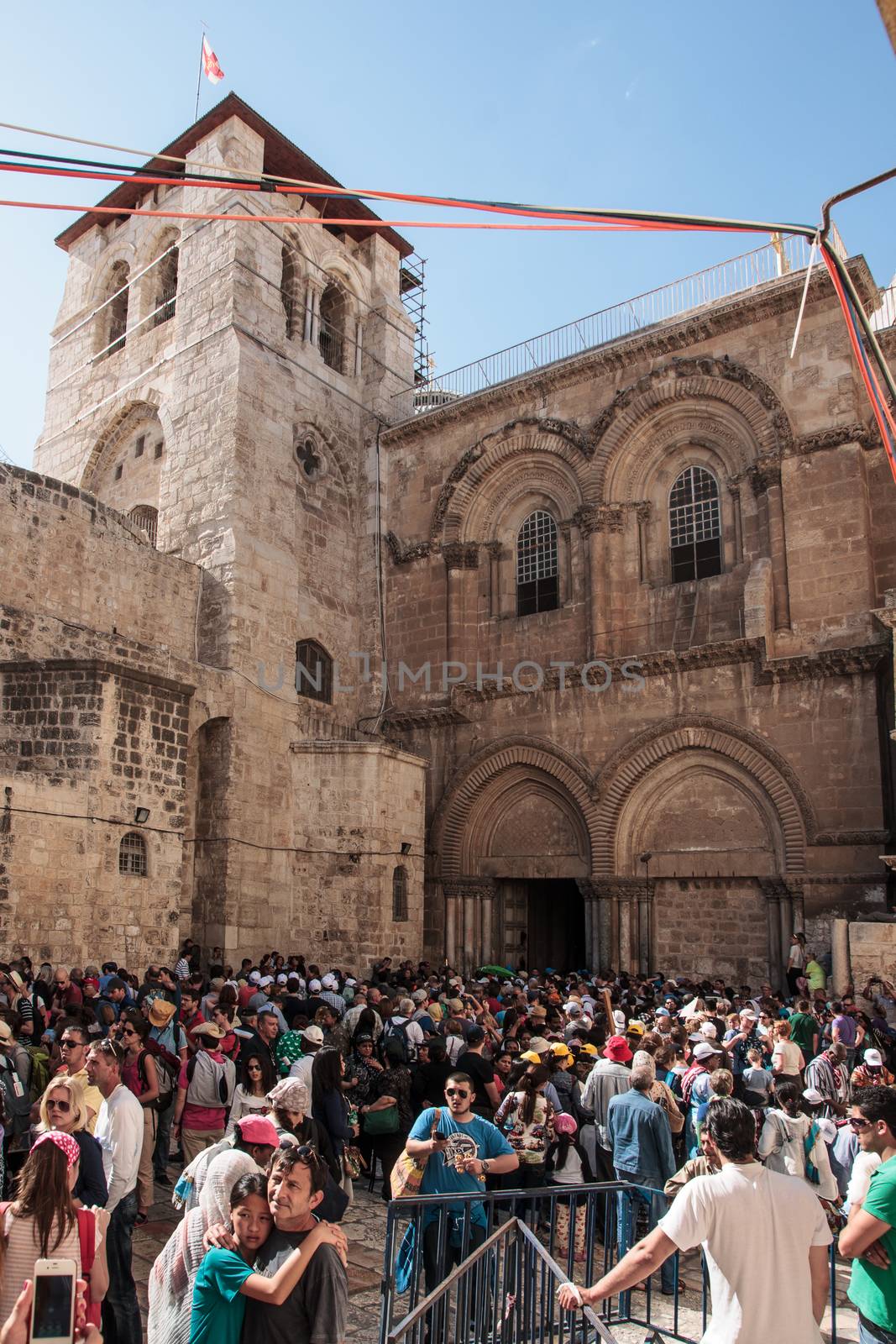 JERUSALEM - APRIL 18, 2014: A crowd of pilgrims fills the front yard of the Church of the Holy Sepulcher, on Good Friday, in the old city of Jerusalem, Israel