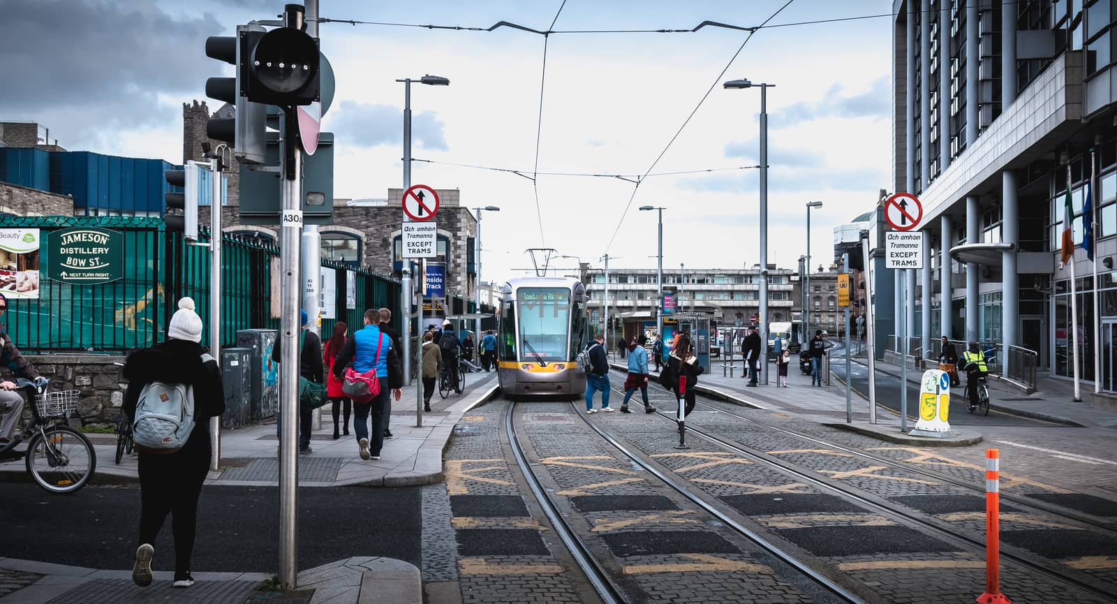 Passengers waiting for an electric tram in Dublin, Ireland by AtlanticEUROSTOXX