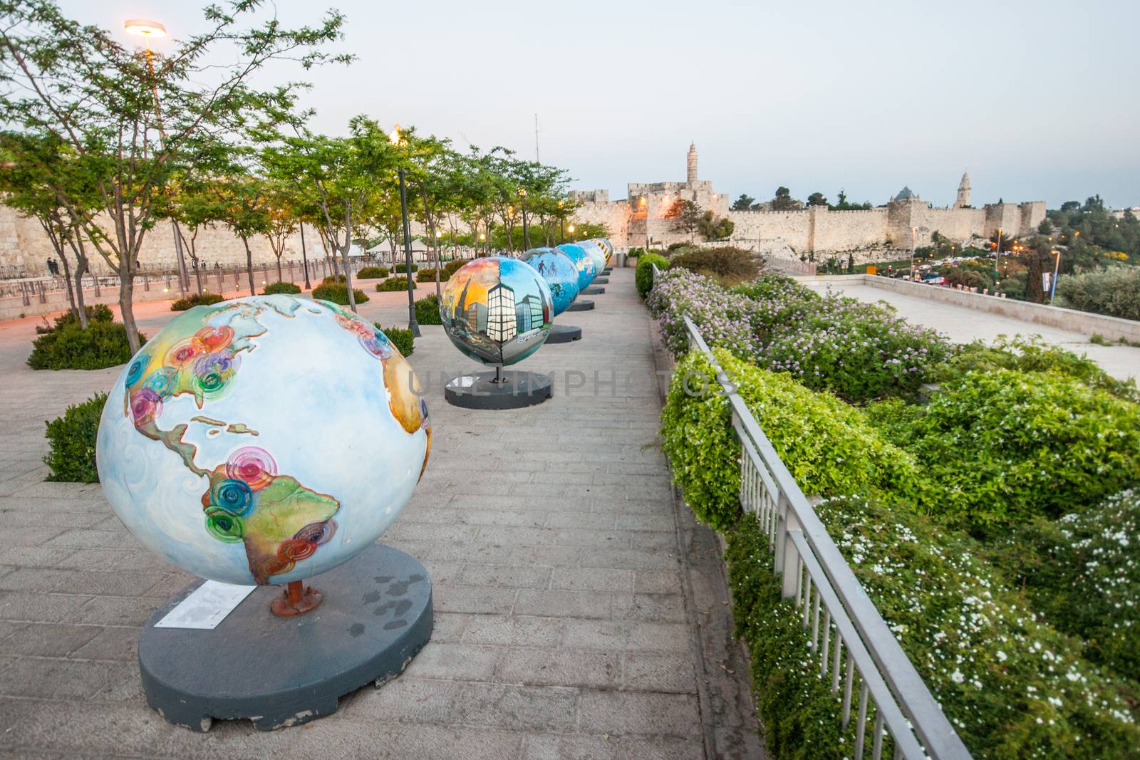JERUSALEM - APRIL 18, 2014: An ecological display of globes, and the walls of the old city, in Jerusalem, Israel