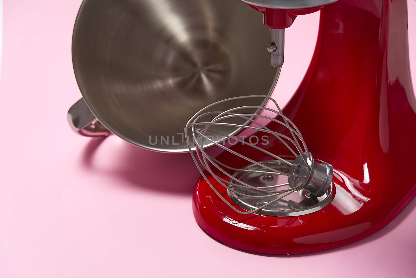 Stylish Red Kitchen Mixer With Clipping Path Isolated On pink Background. Professional steel electric mixer with Metal Whisk by PhotoTime