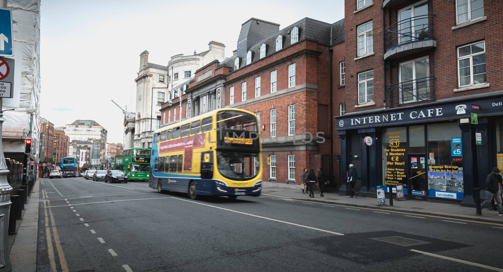 Irish Typical bus traveling down Dublin, ireland by AtlanticEUROSTOXX