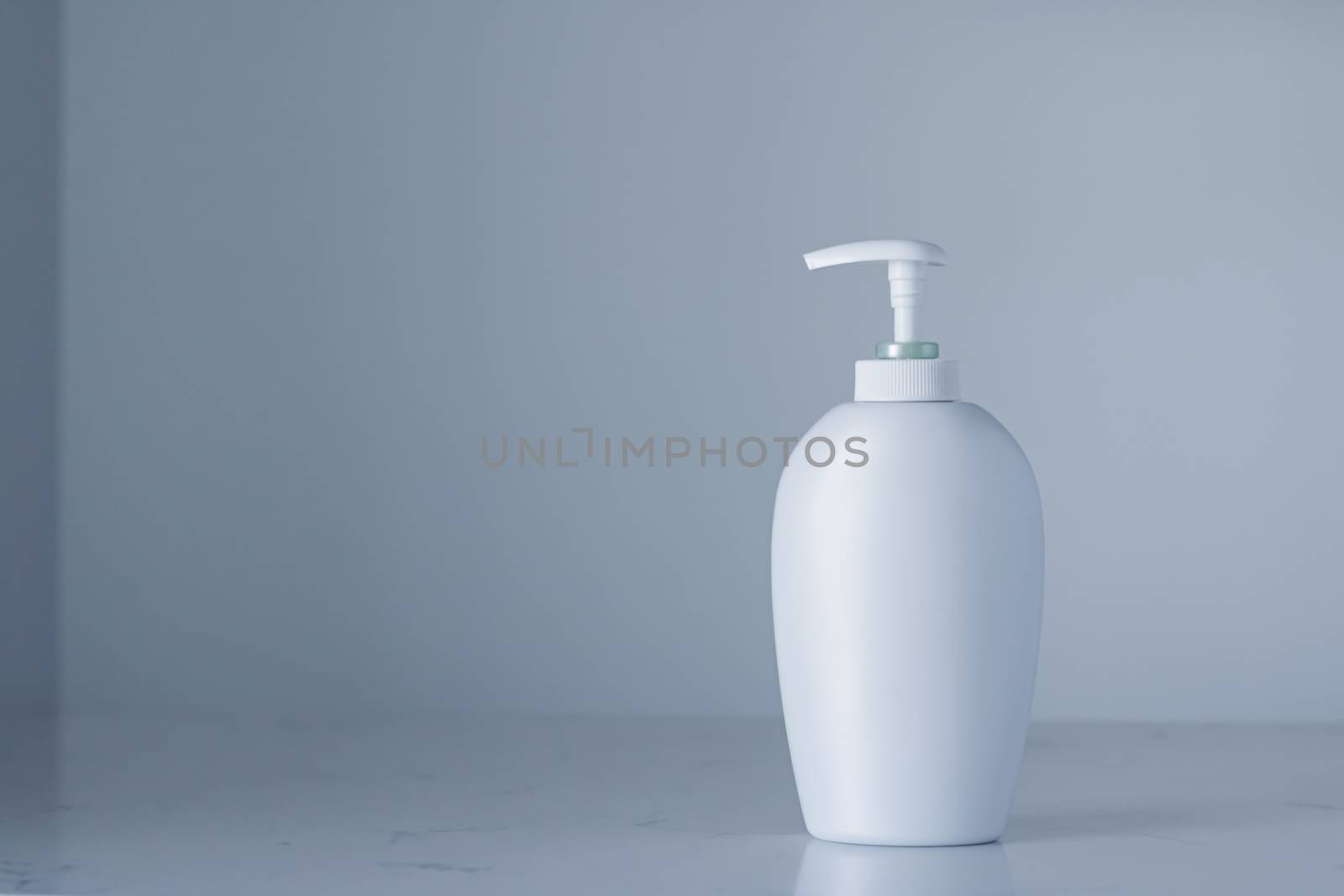 Blank label cosmetic container bottle as product mockup on gray background, hygiene and healthcare