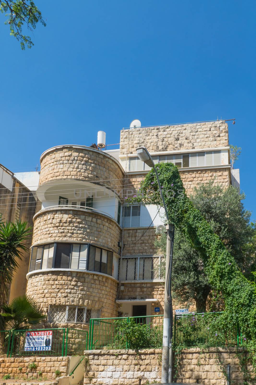 HAIFA, ISRAEL - JUNE 09, 2018: Buildings with a mixture of international (Bauhaus) and Arabic styles, in Hadar HaCarmel neighborhood, Haifa, Israel