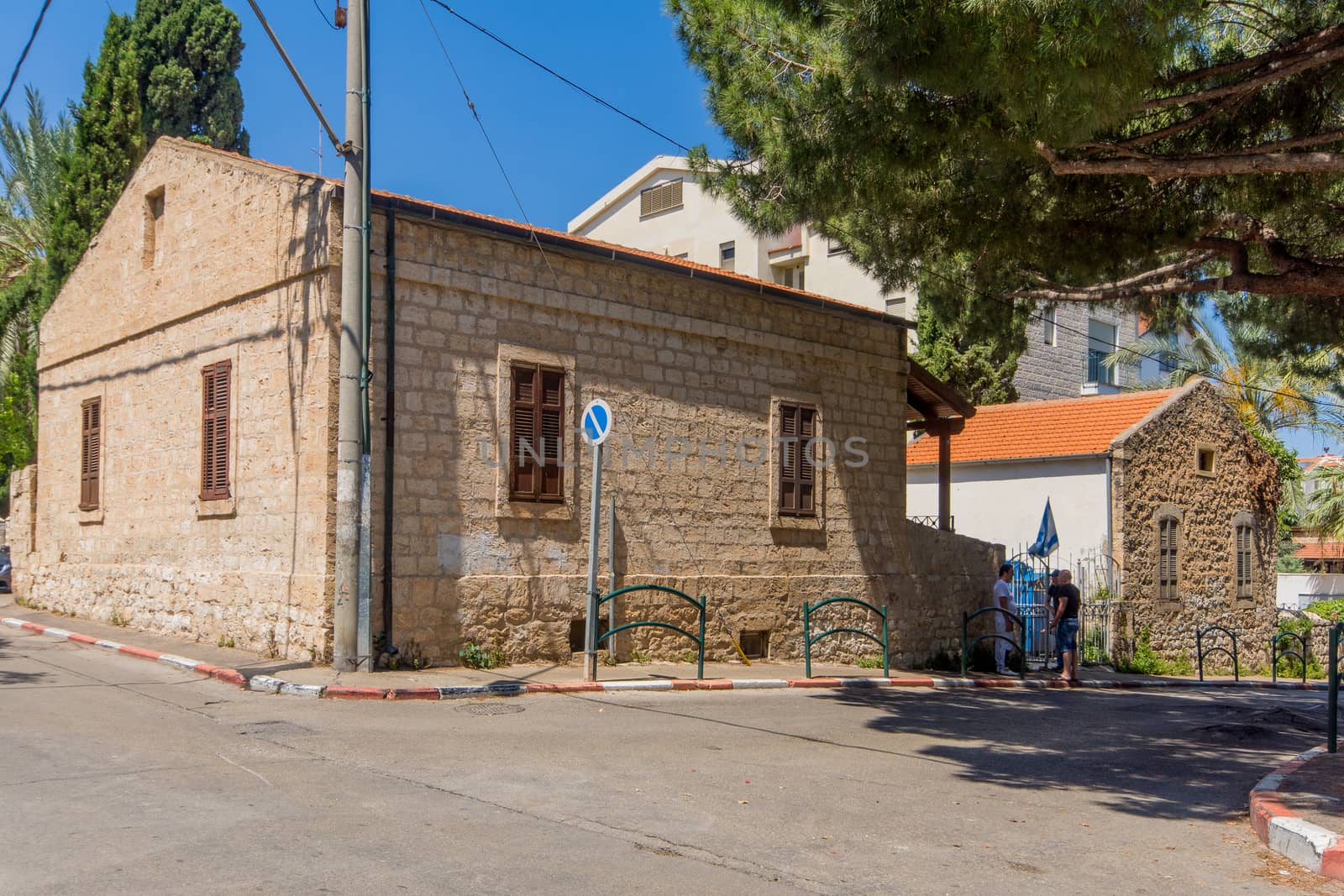 HAIFA, ISRAEL - JUNE 15, 2018: Old Templers buildings (Carmelheim colony), with locals, in Haifa, Israel