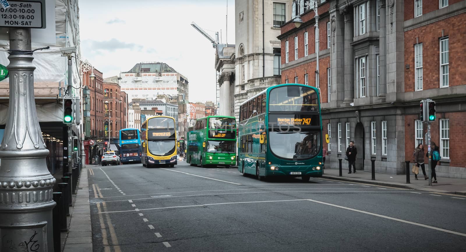 Dublin, Ireland - February 11, 2019: Typical bus traveling down Dublin Street on a winter day