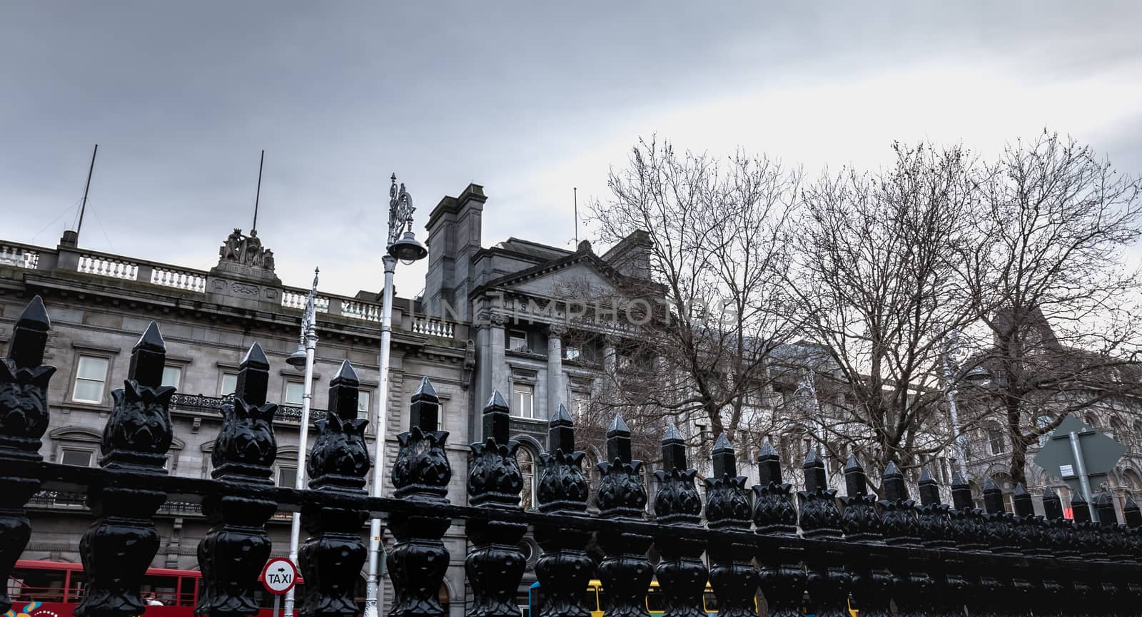 Dublin, Ireland - February 11, 2019: Architectural detail and street atmosphere in front of the Ulster Bank Commercial Bank building in the historic city center on a winter day