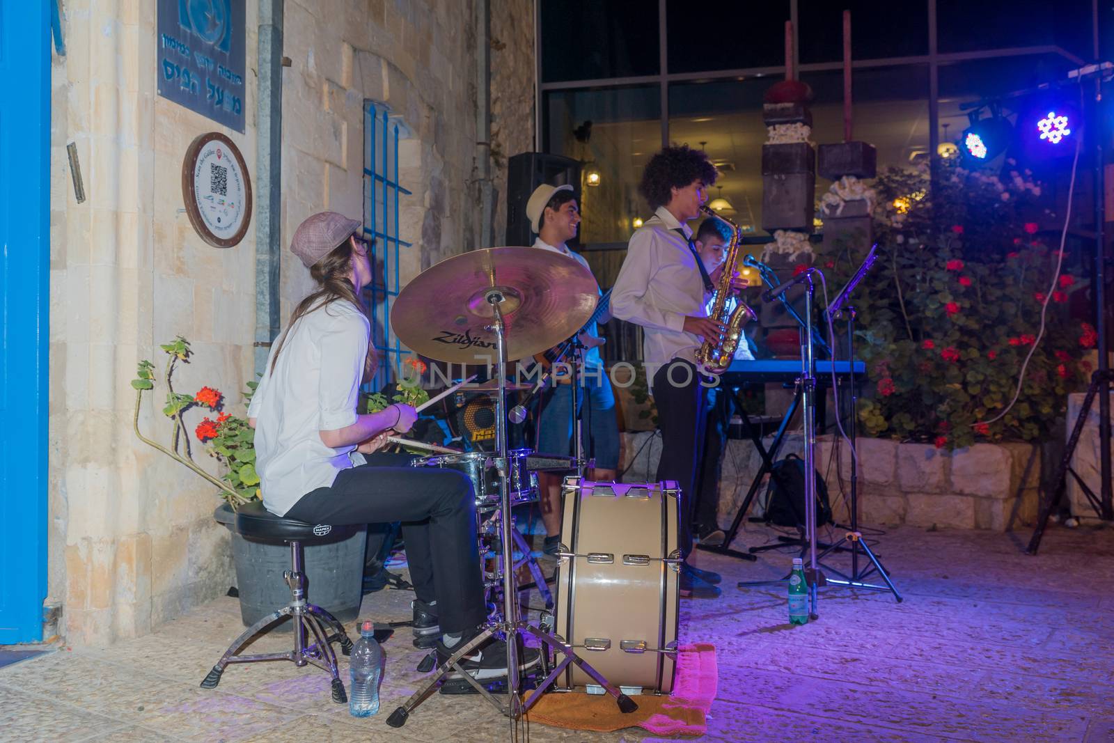 Safed, Israel - August 14, 2018: Scene of the Klezmer Festival, with street musicians playing, in Safed (Tzfat), Israel. Its the 31st annual traditional Jewish festival in the public streets of Safed