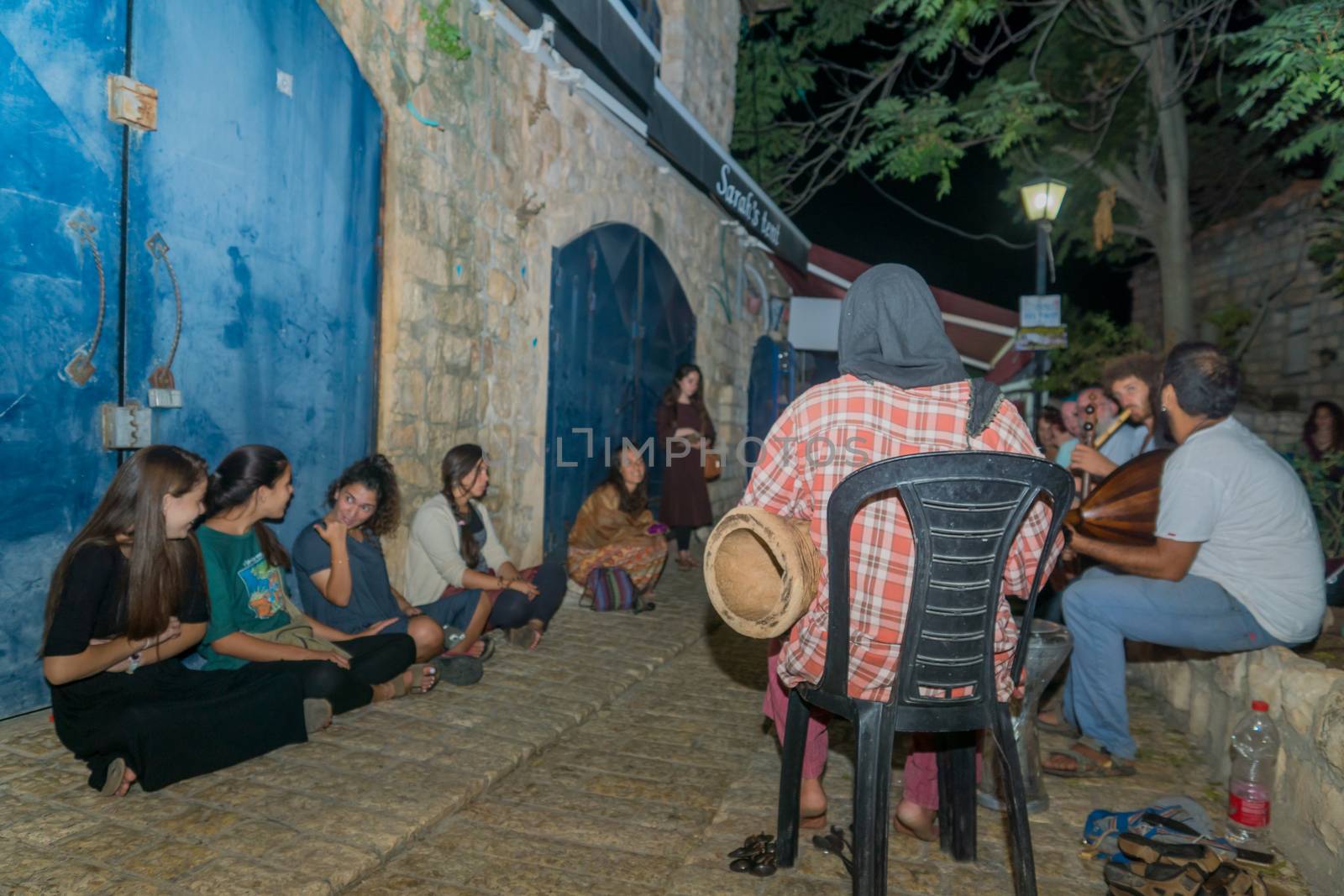 Safed, Israel - August 14, 2018: The Klezmer Festival, with people listen to street musicians, in Safed (Tzfat), Israel. Its the 31st annual traditional Jewish festival in the public streets of Safed