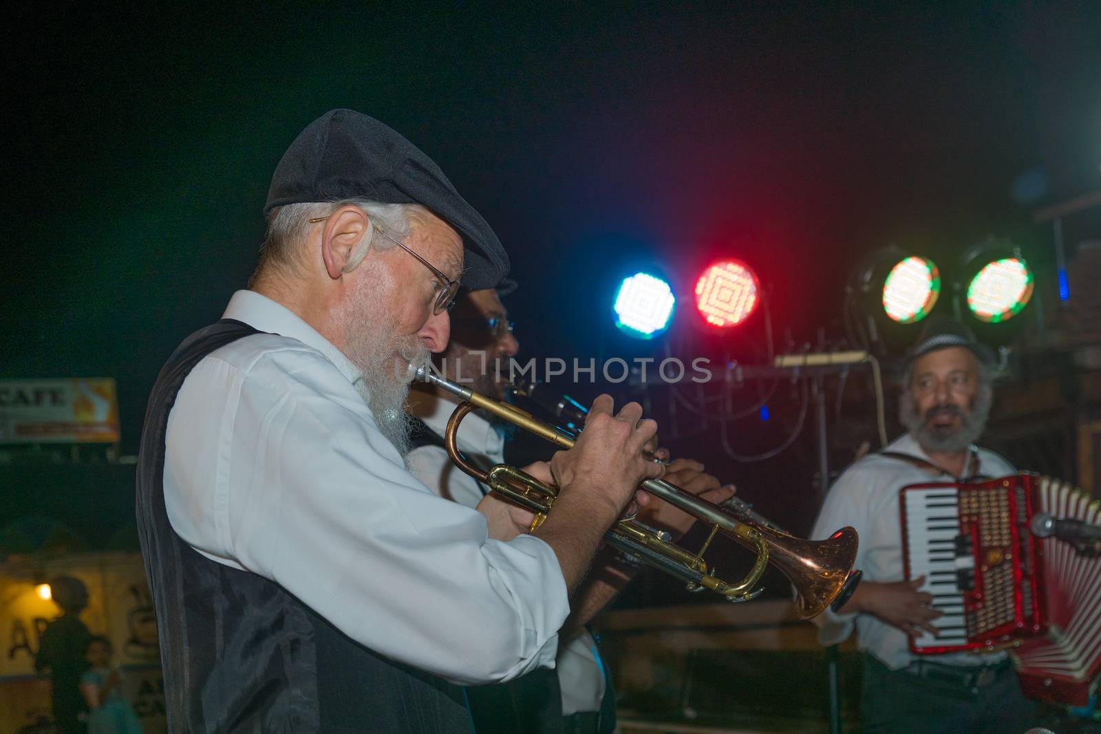 Safed, Israel - August 14, 2018: Scene of the Klezmer Festival, with street musicians playing, in Safed (Tzfat), Israel. Its the 31st annual traditional Jewish festival in the public streets of Safed