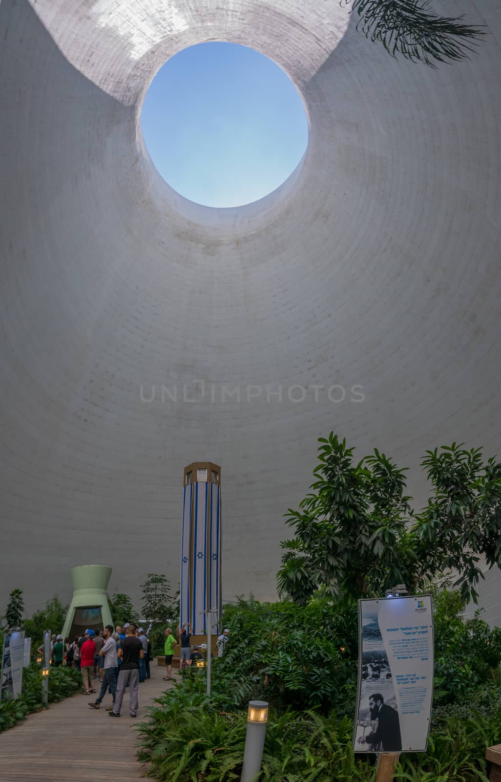 HAIFA, ISRAEL - JULY 20, 2018: Interior view of a Cooling tower in Haifa Oil Refinery compound, now a visitor center, with visitors, in Haifa, Israel
