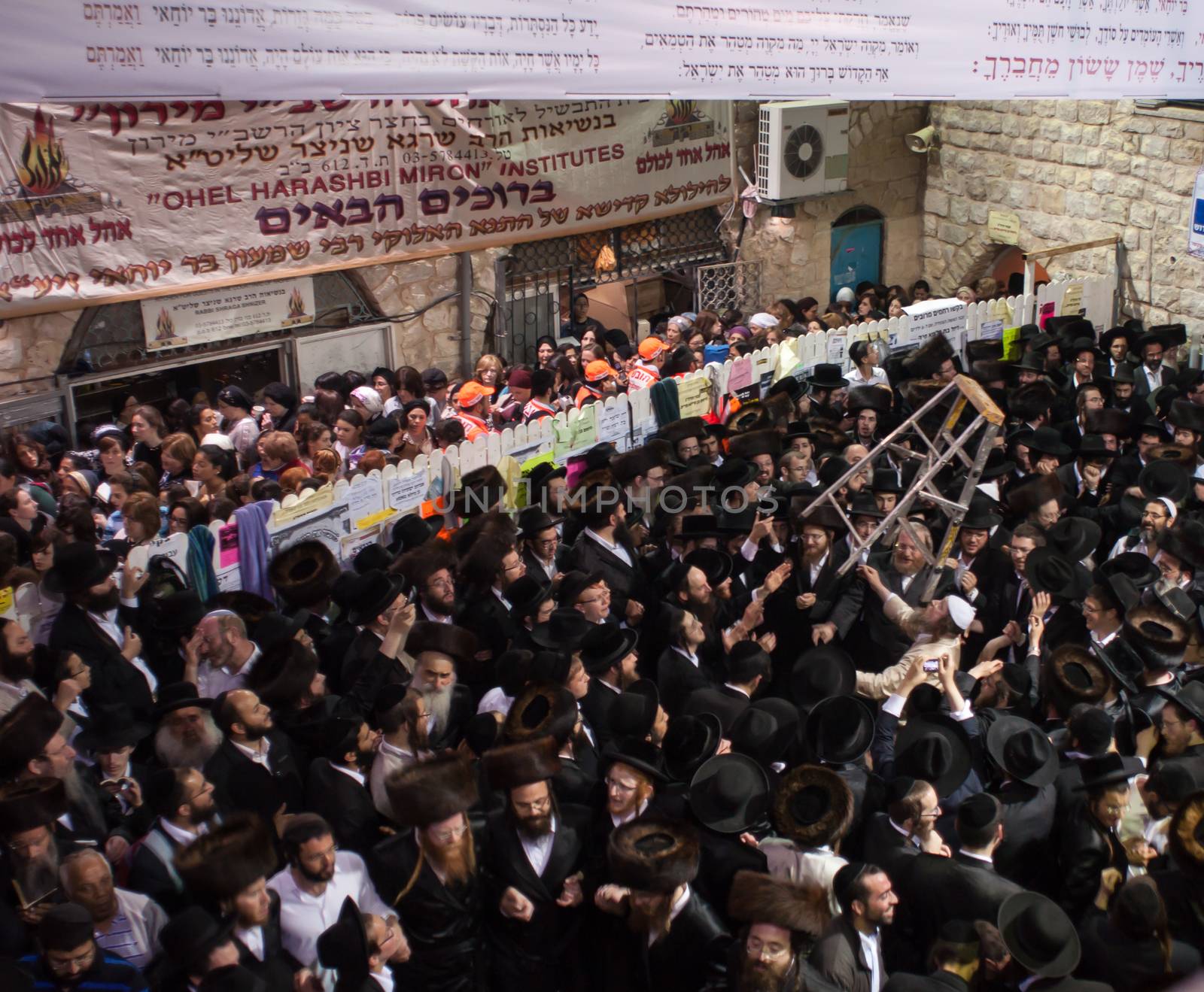 MERON, ISRAEL - MAY 18, 2014: Orthodox Jews dance at the annual hillulah of Rabbi Shimon Bar Yochai, in Meron, on Lag BaOmer Holiday. This is an annual celebration at the tomb of Rabbi Shimon