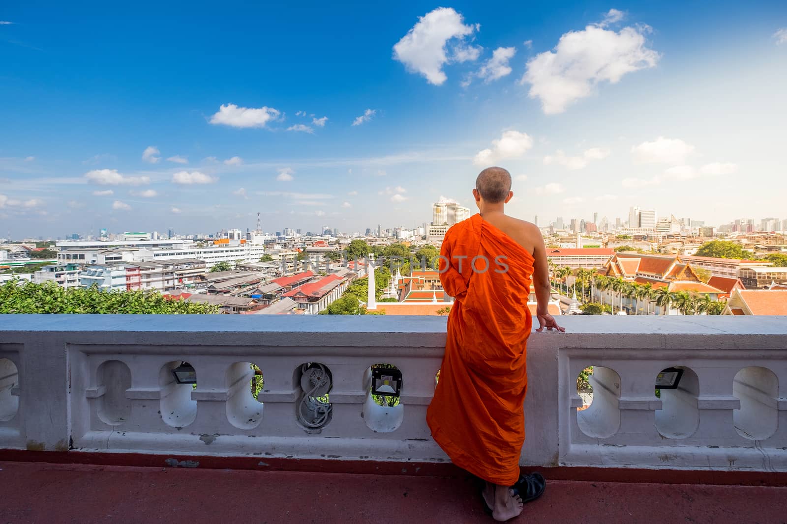 Unidentified buddhist monks in City view point at Golden moutain by Surasak