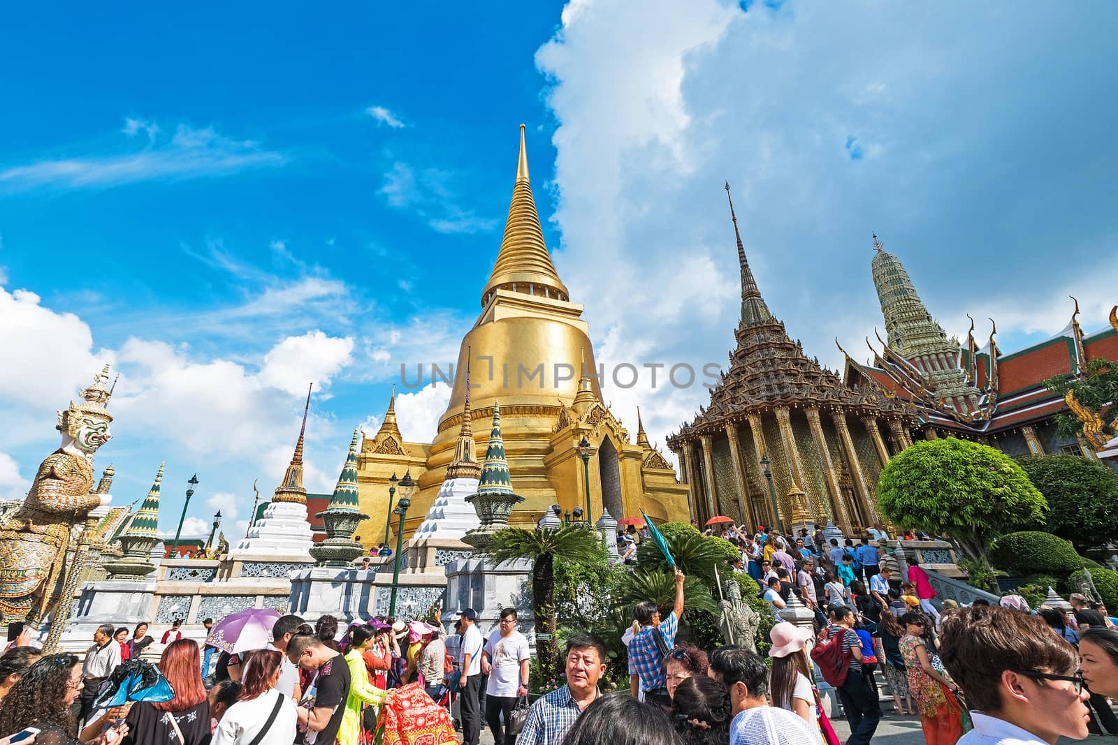 BANGKOK, THAILAND - JAN 9 : Unidentified tourists at Wat Phra Kaew on Jan 9 2016 in Bangkok, Thailand. Wat Phra Kaew is one of the most popular tourists destination in Thailand.