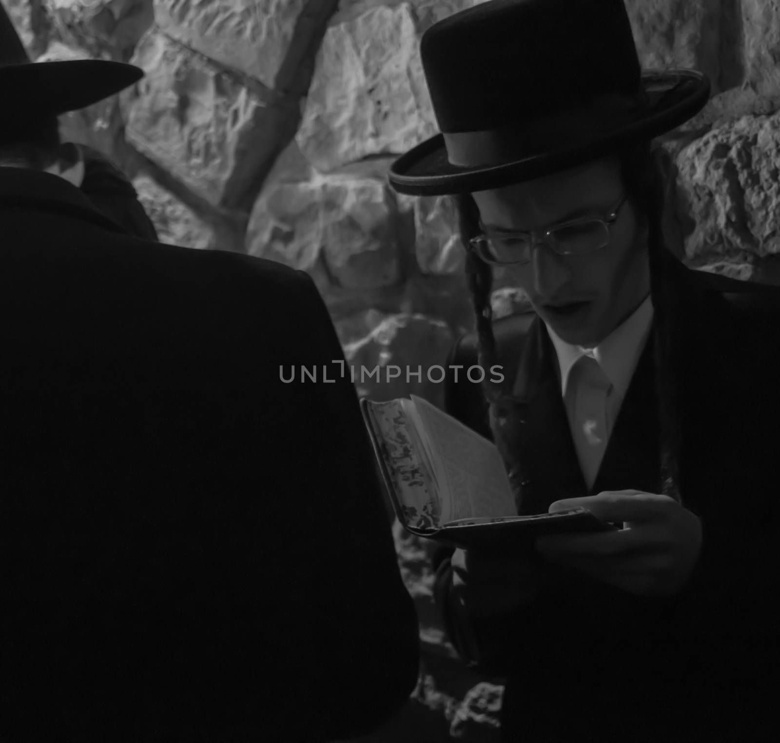 MERON, ISRAEL - MAY 18, 2014: An orthodox Jew prays at the annual hillulah of Rabbi Shimon Bar Yochai, in Meron, on Lag BaOmer Holiday. This is an annual celebration at the tomb of Rabbi Shimon