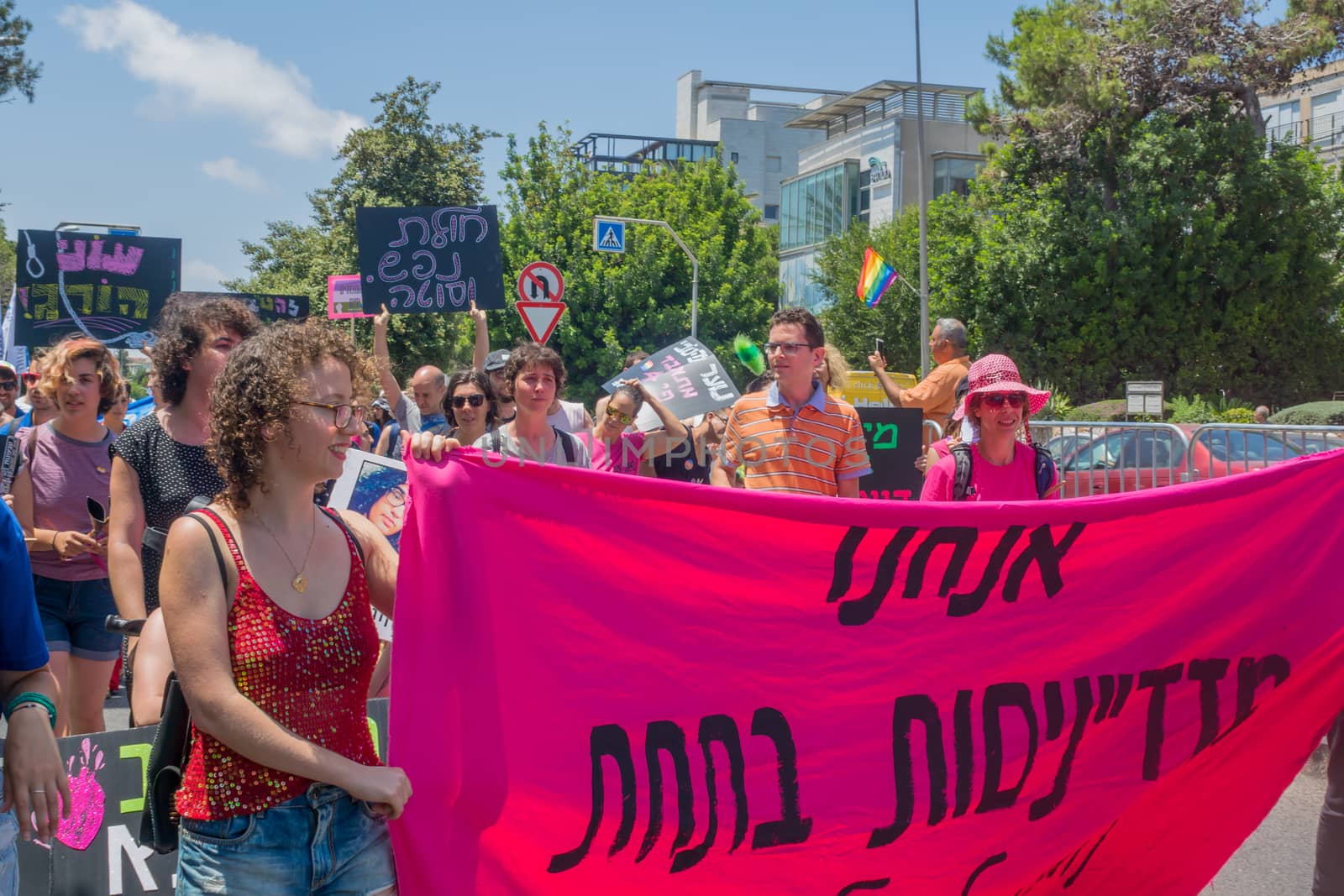 HAIFA, ISRAEL - JUNE 22, 2018: Various people take part and carry signs, in the annual pride parade of the LGBT community, in Haifa, Israel