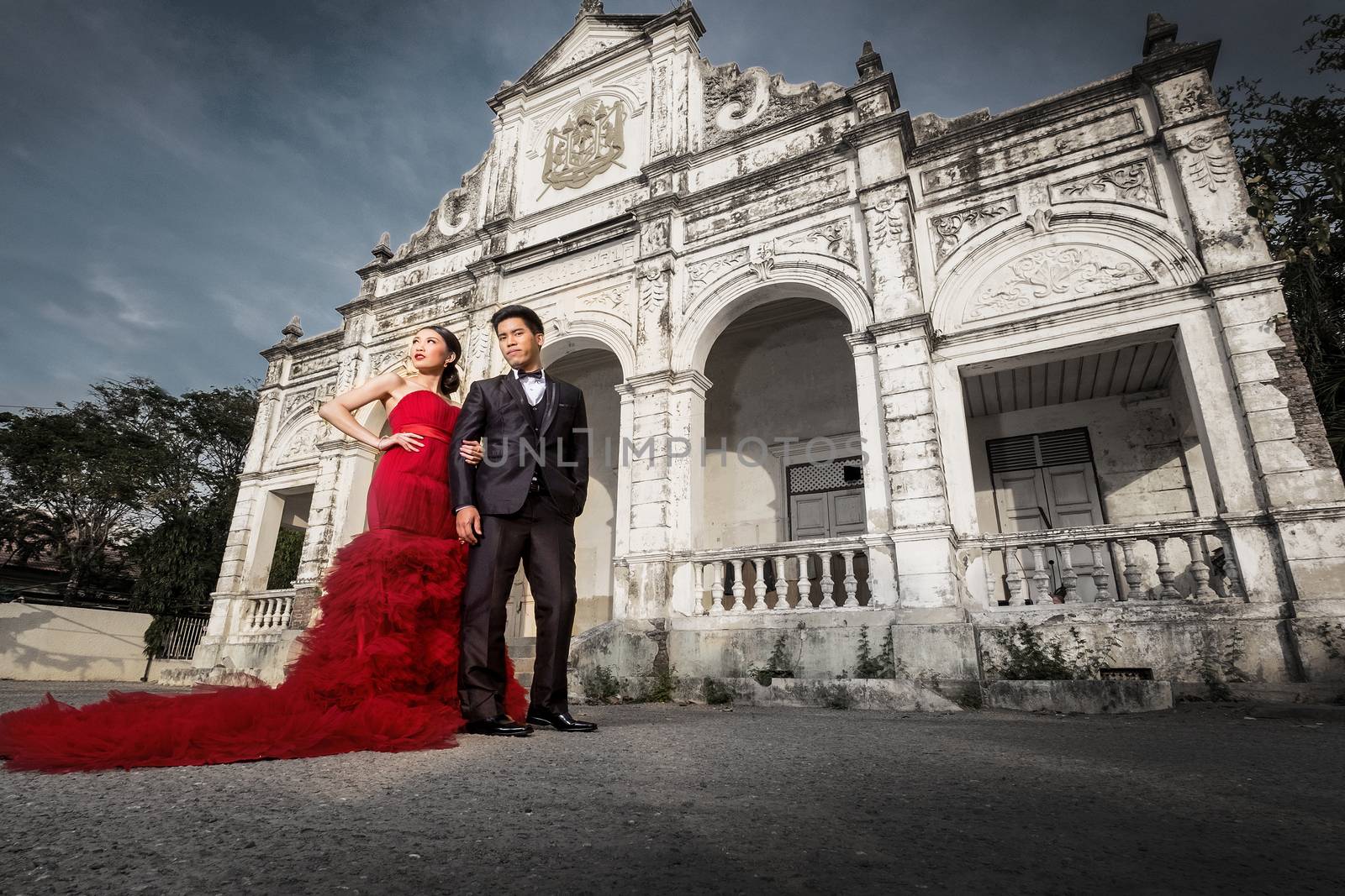 Man and Beautyful woman wearing fashionable red dress