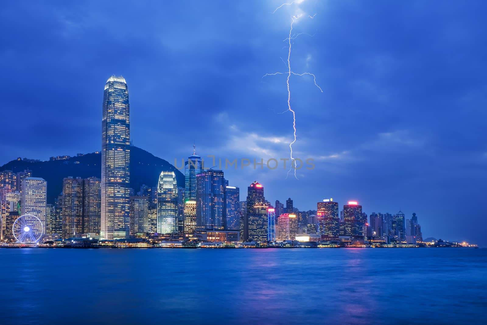 Thunderstorm HongKong cityscape at night , Hong kong city. by Surasak