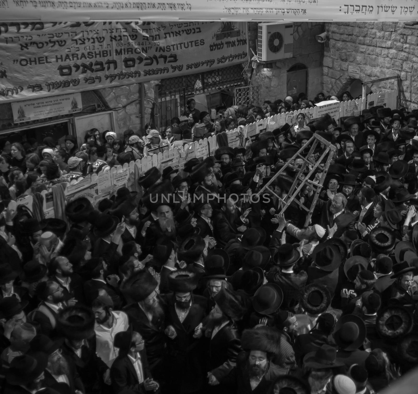 MERON, ISRAEL - MAY 18, 2014: Orthodox Jews dance at the annual hillulah of Rabbi Shimon Bar Yochai, in Meron, on Lag BaOmer Holiday. This is an annual celebration at the tomb of Rabbi Shimon